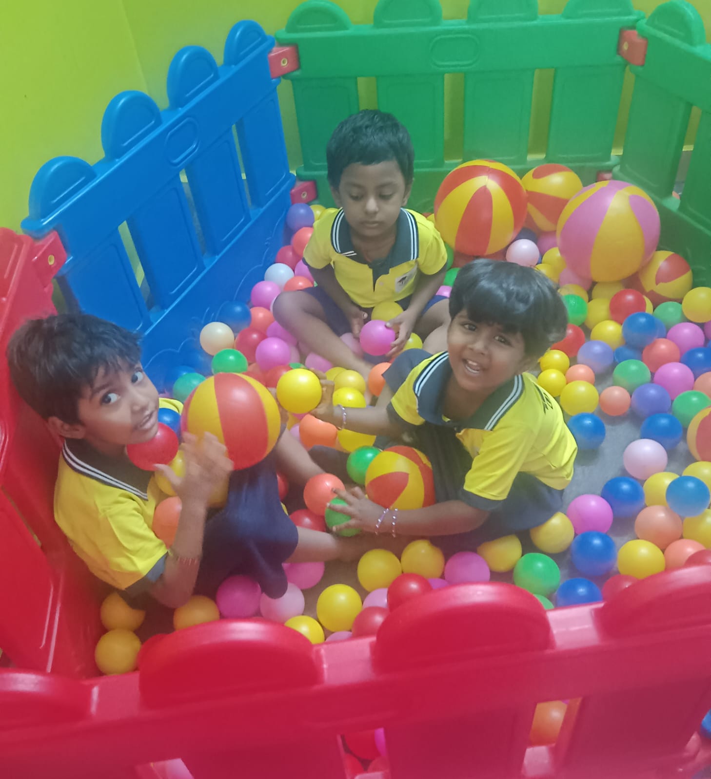 Children enjoying the ball pool at Uyirmei Academy